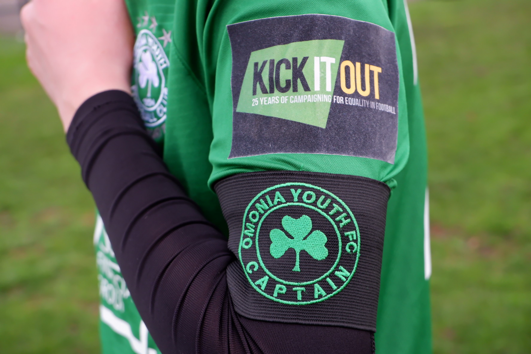 ‘Kick it Out’ logo on our kit