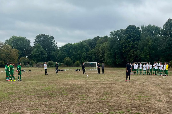 Omonia Youth FC U14 Greens and Whites observing a minute's silence